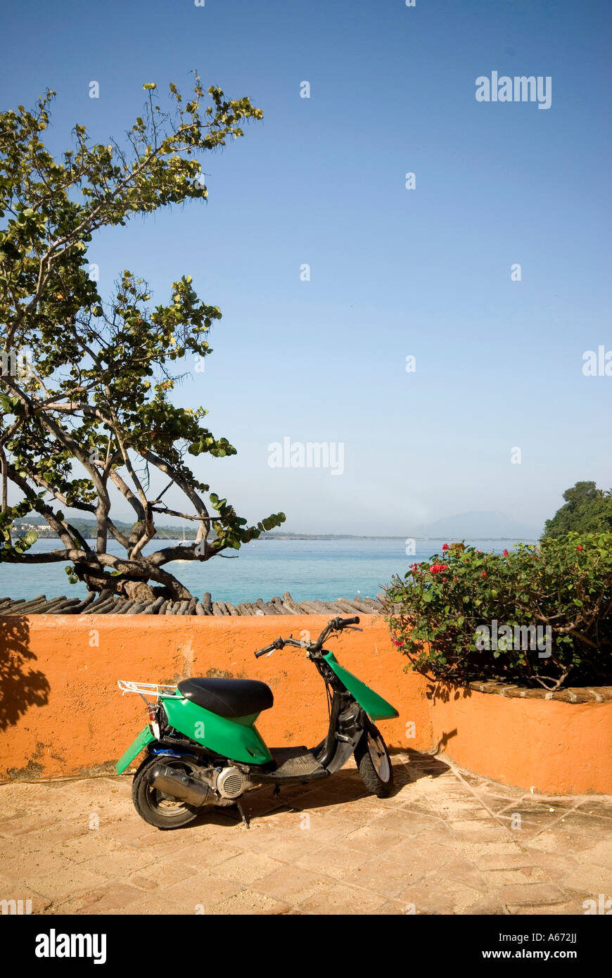 motorcycle scooter by caribbean sea sosua bay dominican republic Stock