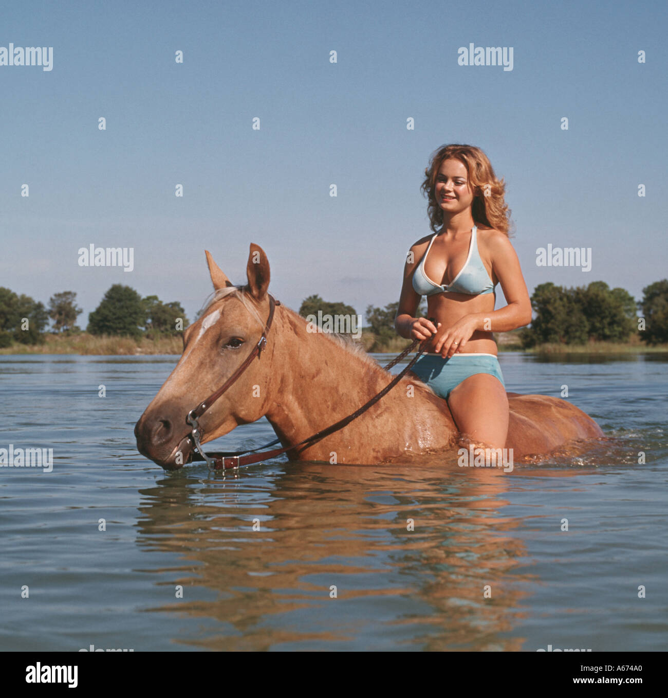 Girl in bikini horse riding hi-res stock photography and images - Alamy