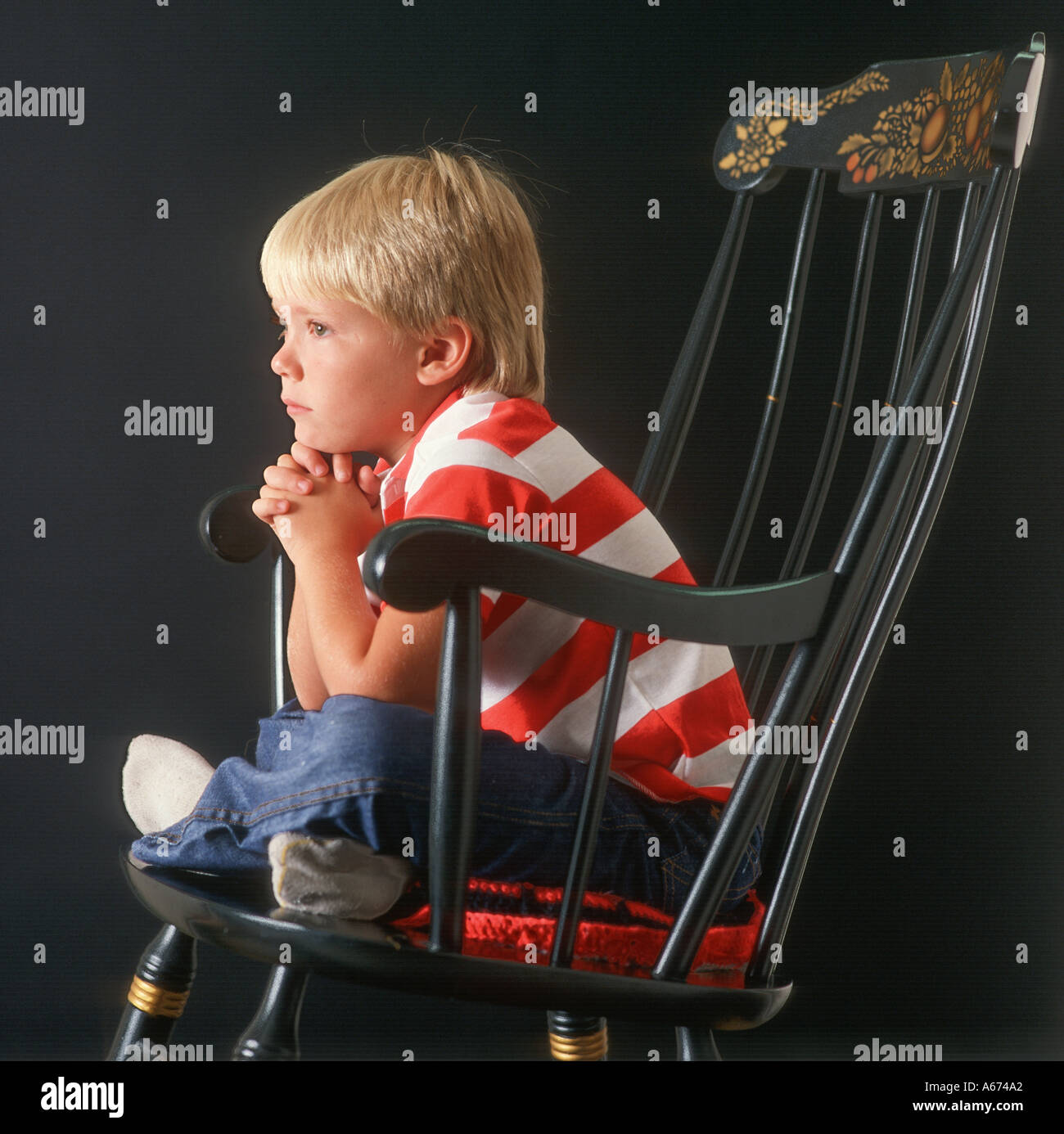 small boy sitting in rocking chair watching TV Stock Photo - Alamy