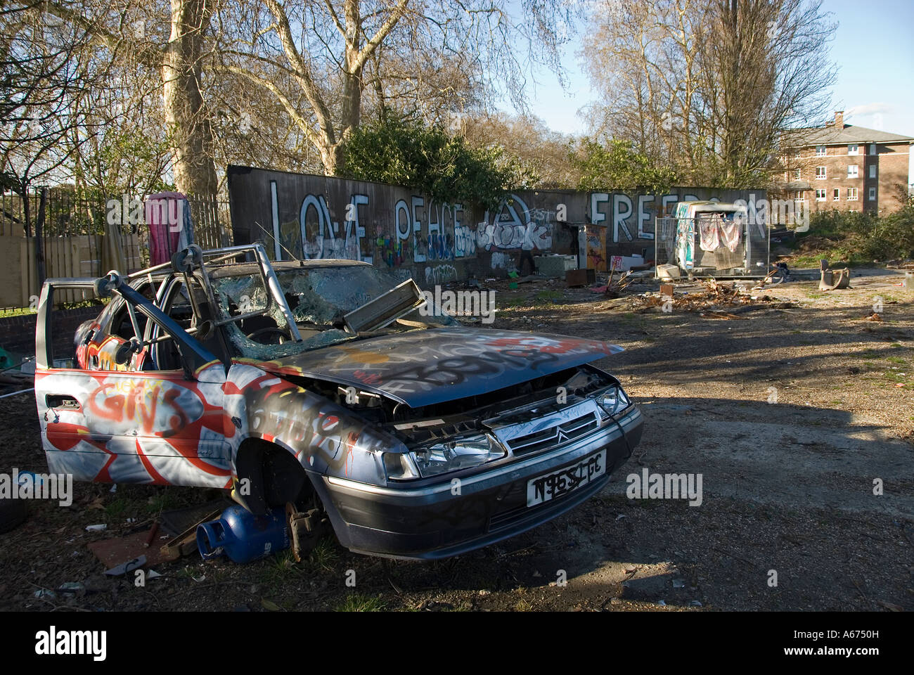 Burnt out car on wasteland, Canbury Gardens, Kingston upon Thames, Surrey, England, UK Stock
