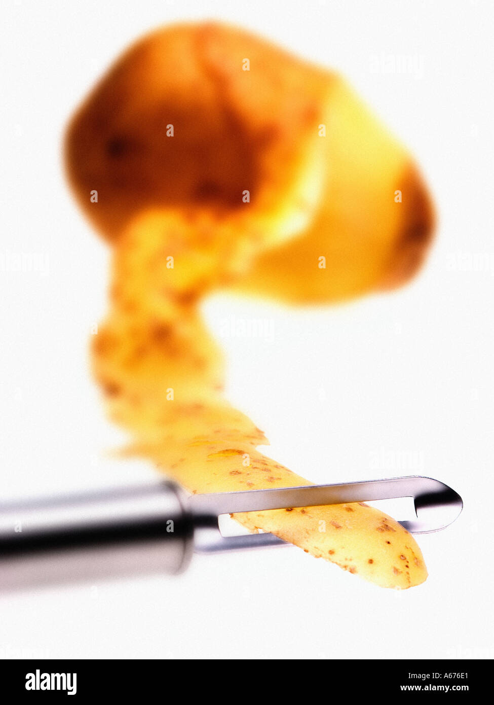 potato and chrome peeler Stock Photo