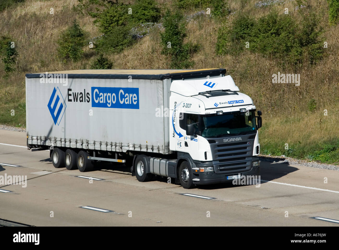 M25 motorway Ewals Cargo Care articulated trailer and Scania lorry