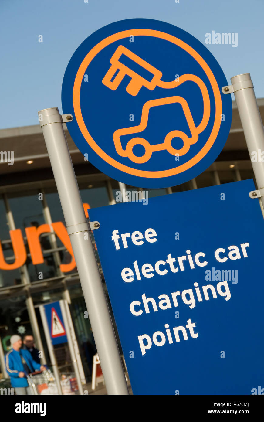 Sign outside Sainsbury supermarket store advertising free electric car charging point Stock Photo