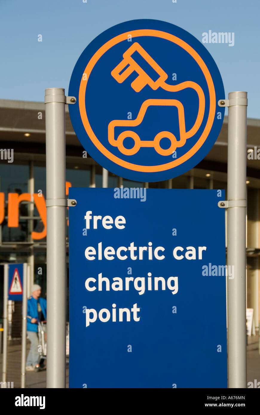 Outdoor sign in Sainsbury supermarket store car park advertising free electric car charging point an early adopter & rare sight in 2009 Greenwich UK Stock Photo