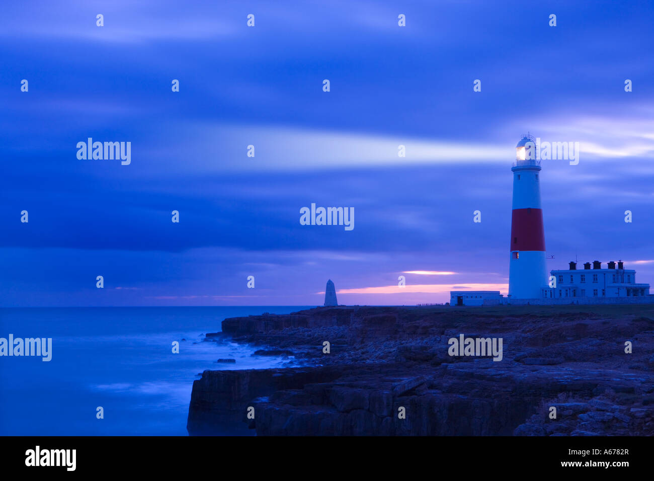 Lighthouse with light beam, Portland Bill, Dorset, England Stock Photo