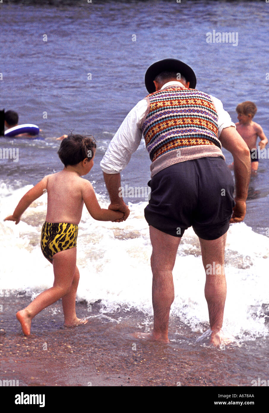 Boy and man on Clacton Beach in 1962  Stock Photo