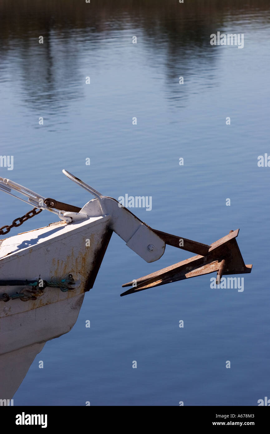 Close up of anchor and bow over calm blue water Stock Photo - Alamy
