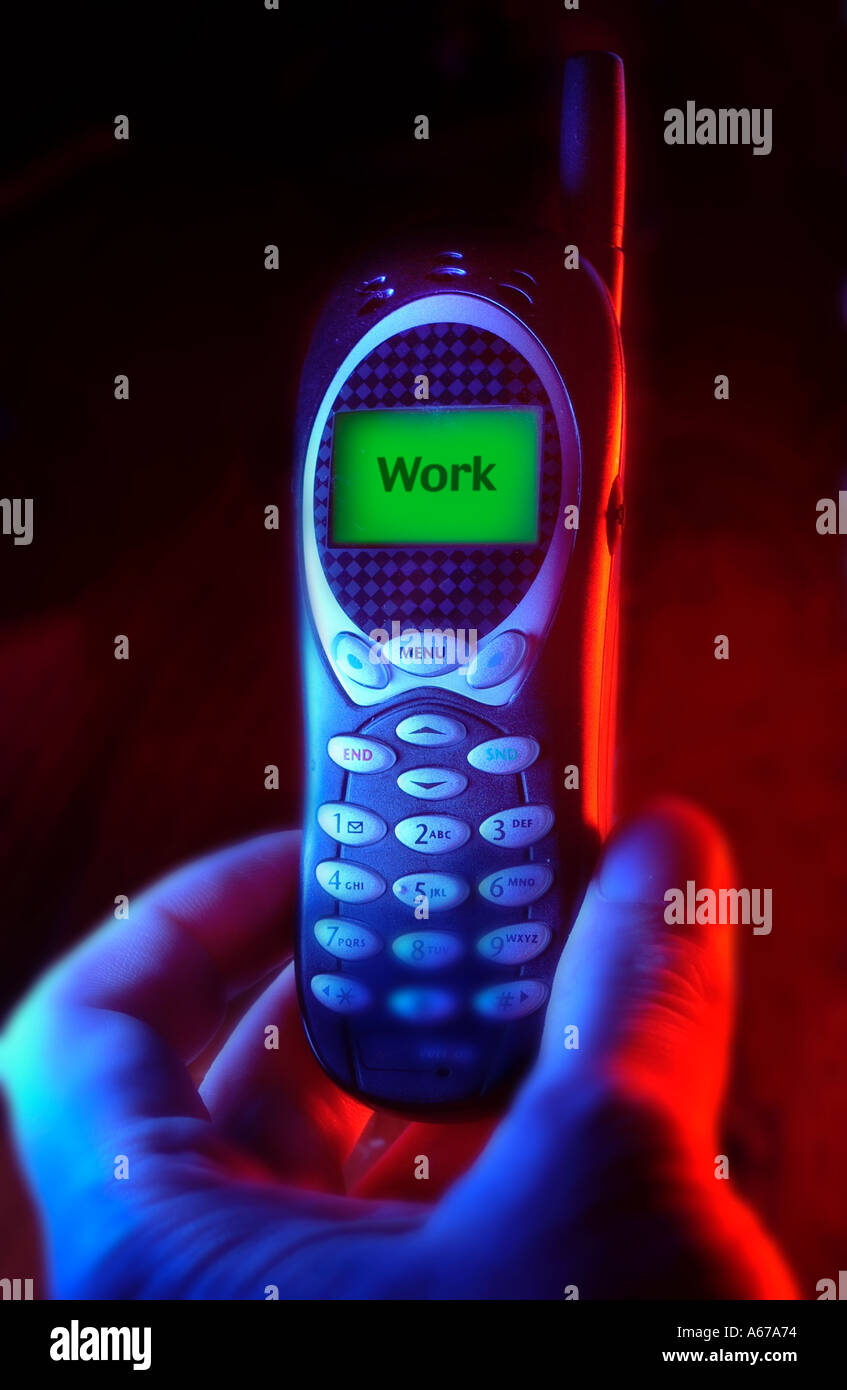 Digital Cell phone with word work on screen with red and blue light Stock Photo