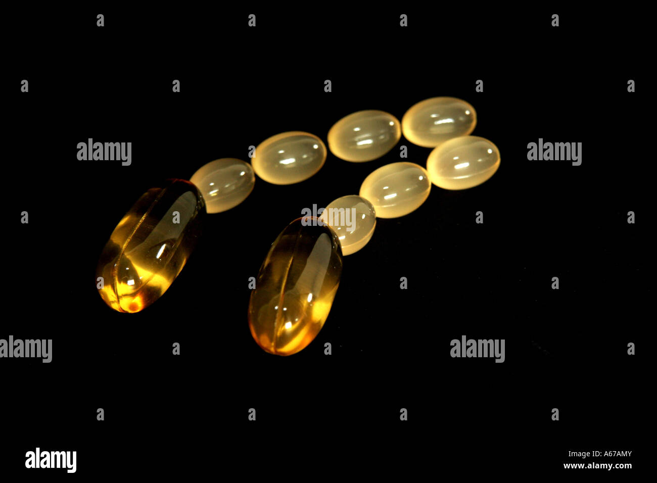 A line of oil capsules Stock Photo Alamy