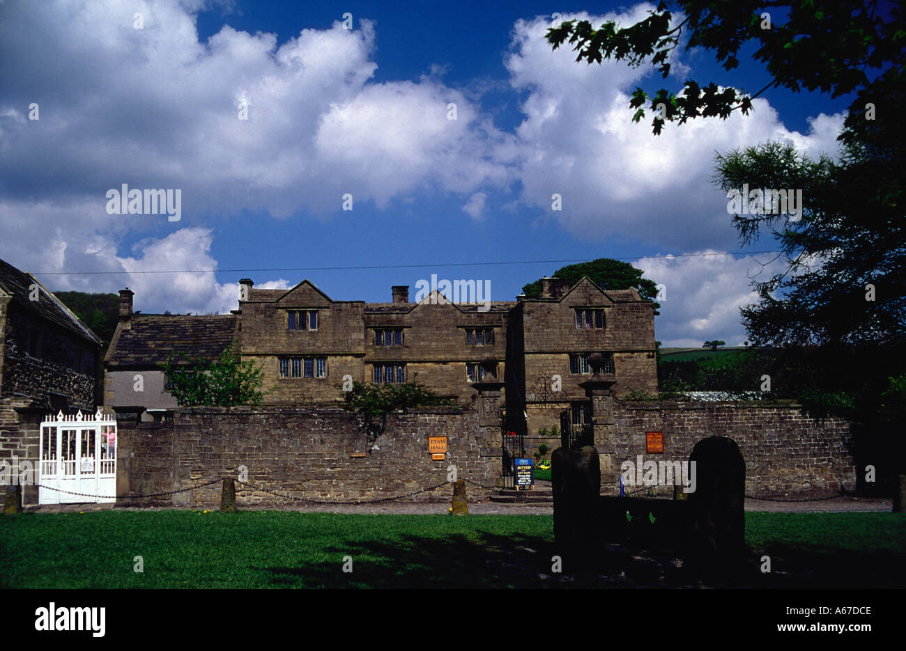 Eyam stocks and Eyam Hall in Derbyshire 'Great Britain' Stock Photo