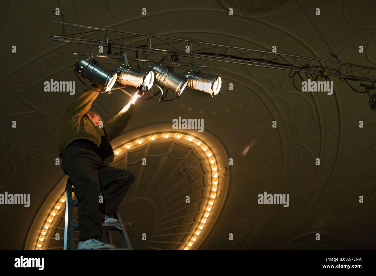 Detroit Michigan A stagehand adjusts lighting at the Majestic Theatre Stock Photo