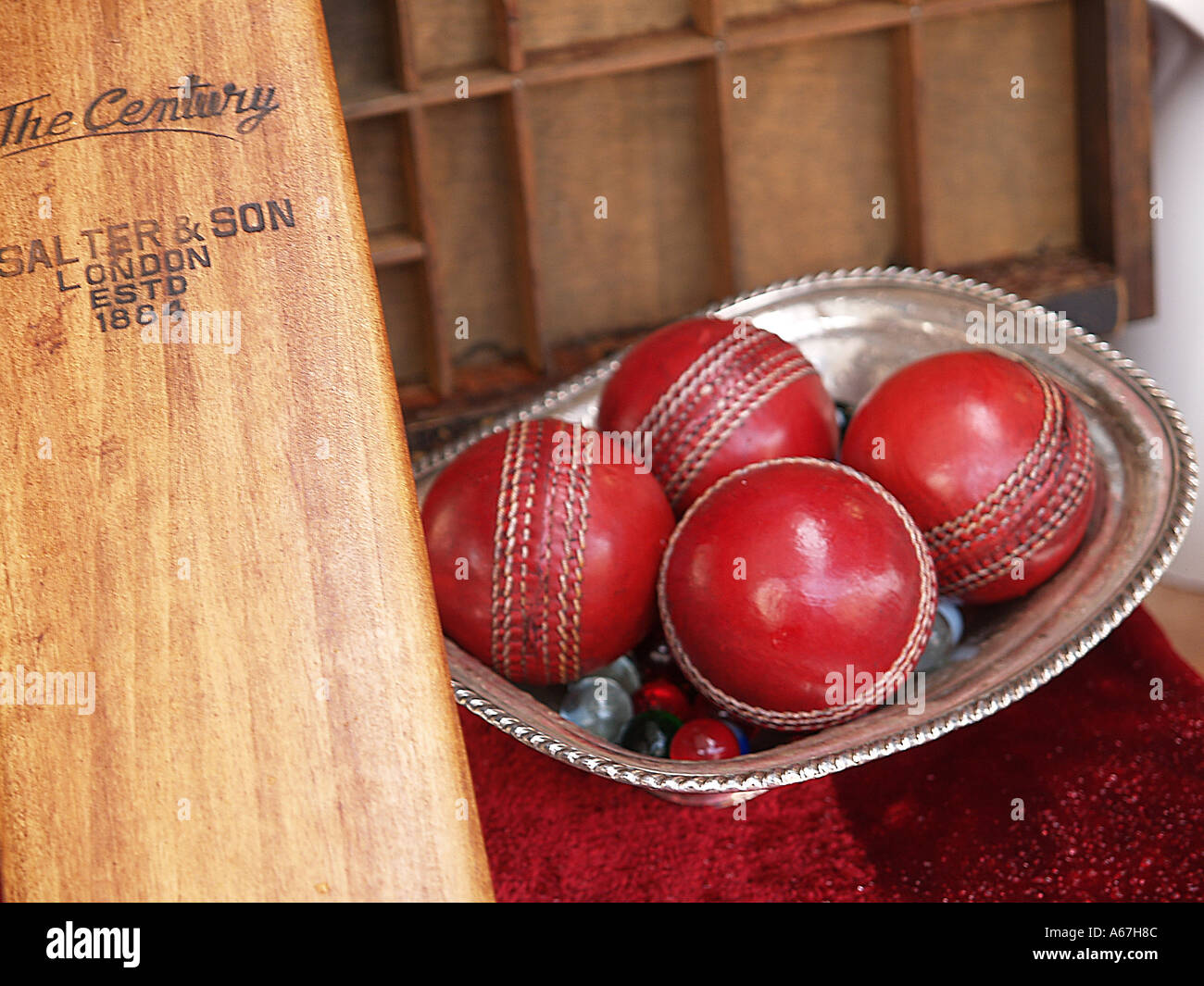 cricket bat and red balls portobello road market notting hill Stock