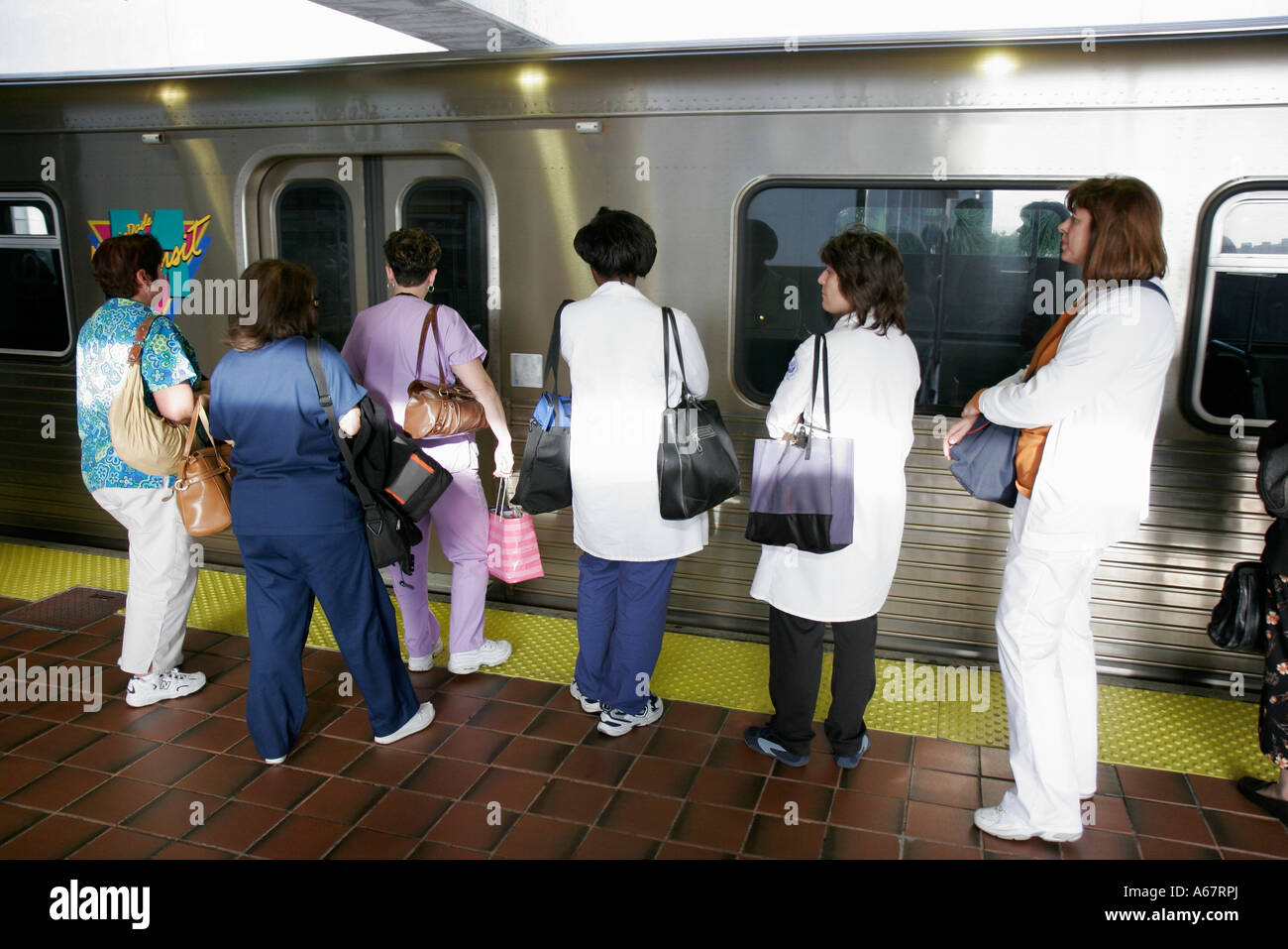 Miami Florida,Metrorail Civic Center Station,nurses board commuter