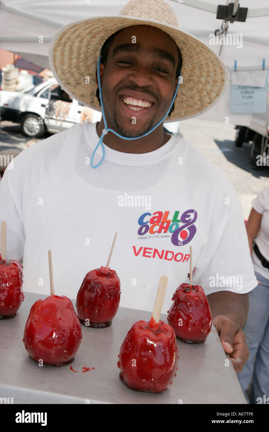 Miami Florida,Little Havana,Calle Ocho,annual,Hispanic festival,festivals fair,Black African Africans,man men male,candy apple,vendor vendors seller s Stock Photo