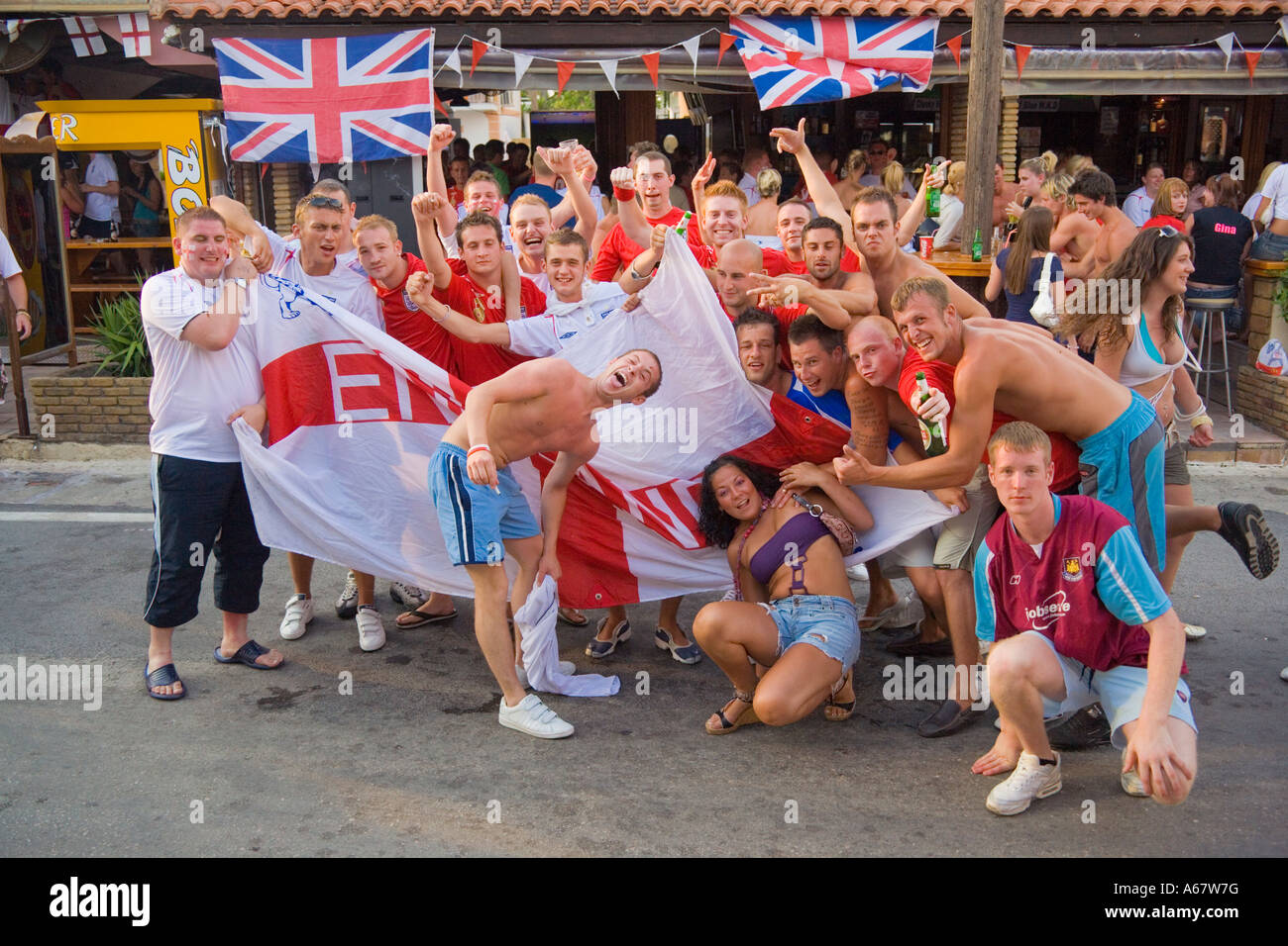 Group of England Soccer fans celebrating in the street in Kavos Corfu Stock Photo: 11489379 - Alamy