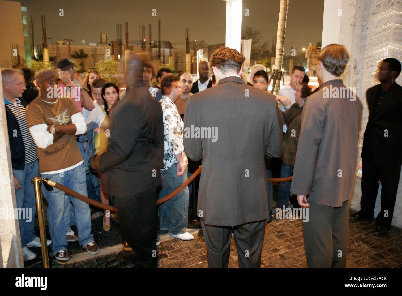 sachin and babi light blue dress Miami Beach Florida,Collins Avenue,Setai,hotel hotels lodging inn motel  motels,club entrance,clubber,security guard,bouncer,night nightlife evening  af Stock Photo