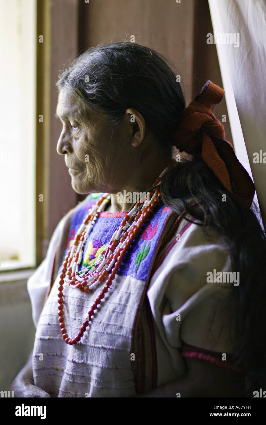 GUATEMALA ACAL Elderly indigenous Mam Mayan woman in traditional dress of huipil corte and tzute Stock Photo