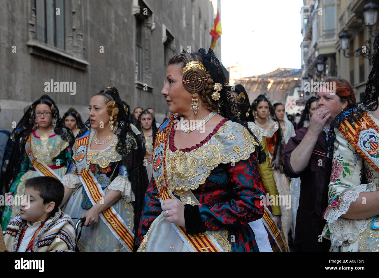 Spanish woman with elaborate spiralled buns on the side of her head, a ...