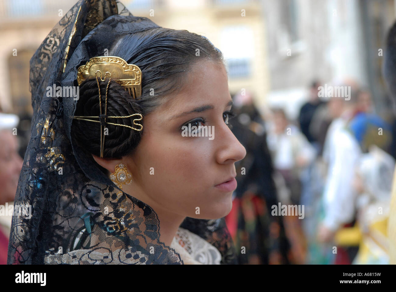 Young Spanish woman with elaborate spiralled bun a traditional Valencian  Fallera hairstyle, during Las Fallas festival in Valencia Spain Stock Photo  - Alamy