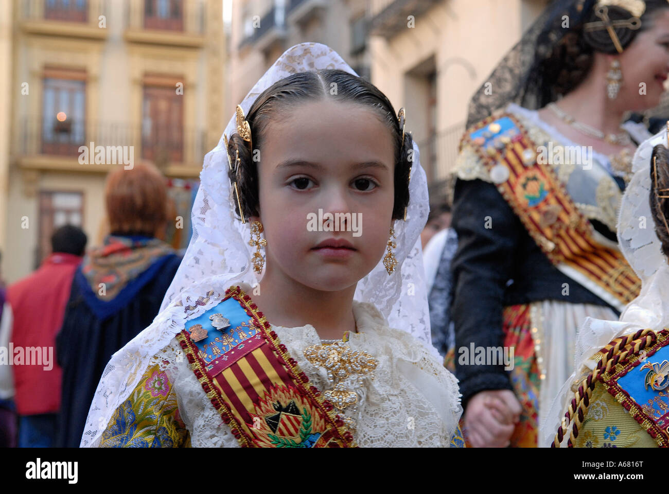 Young Girl With Elaborate Spiralled Buns On The Side Of Her Head A young-girl-with-elaborate-spiralled-buns-on-the-side-of-her-head-a
