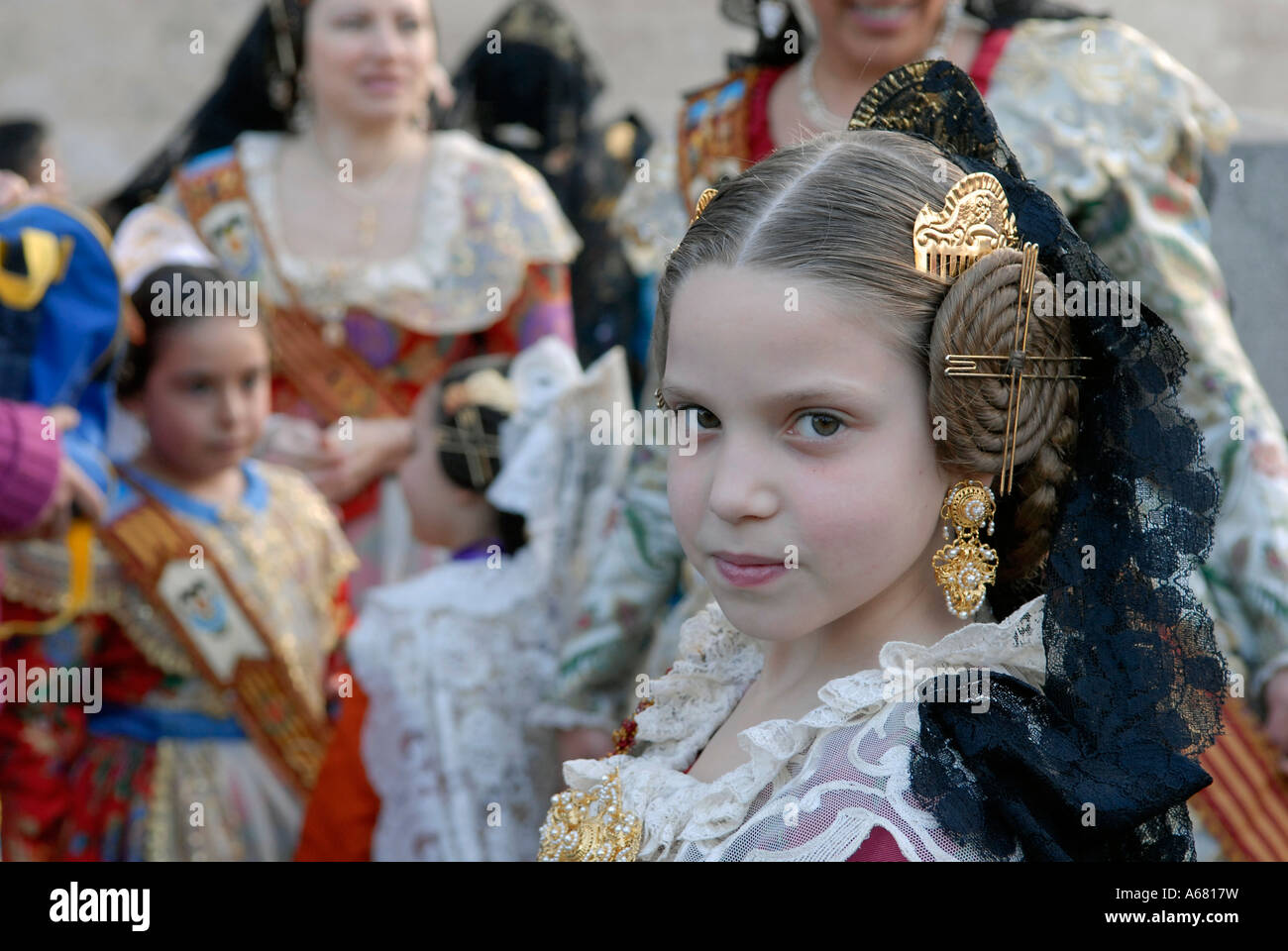 Young Girl With Elaborate Spiralled Buns On The Side Of Her Head A young-girl-with-elaborate-spiralled-buns-on-the-side-of-her-head-a