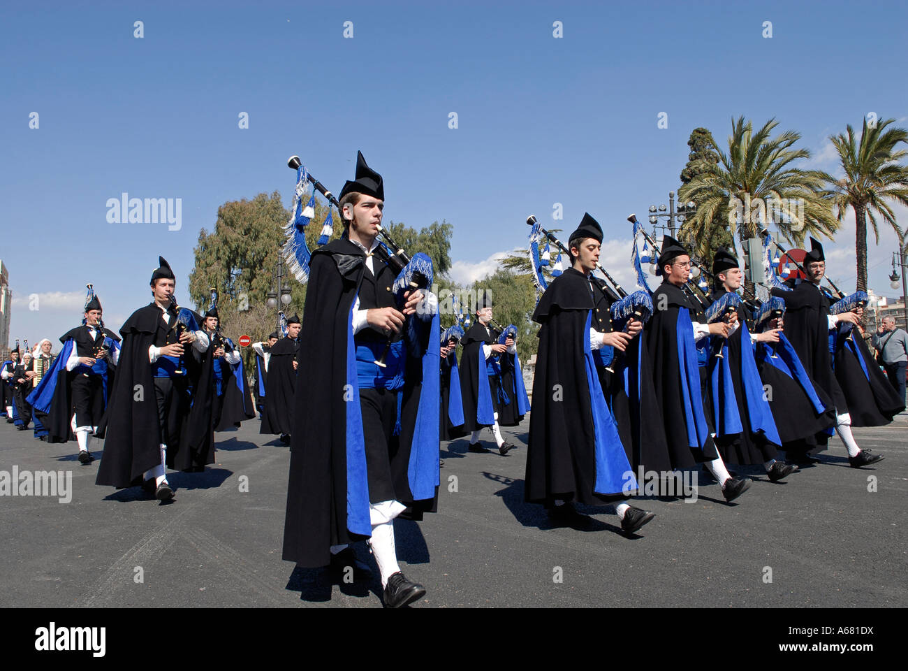 Falleros wearing historic Valencian costume play bagpipes as the march ...