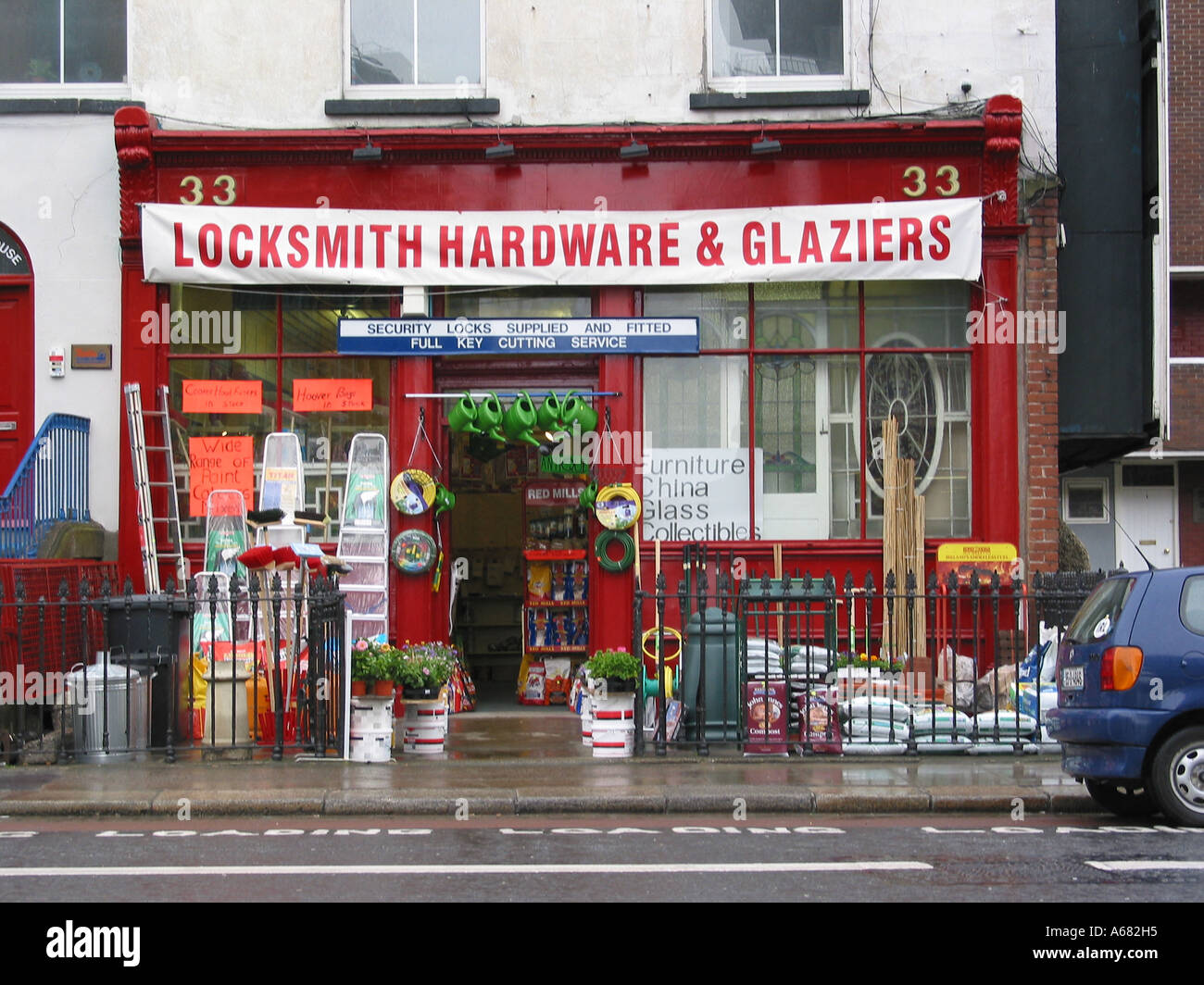 ironmonger displaying his stock on the pavement Dublin Ireland Stock Photo