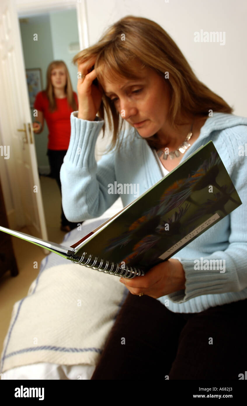 Mother And Daughter Training Diary mother reading teenage daughter's diary Stock Photo - Alamy