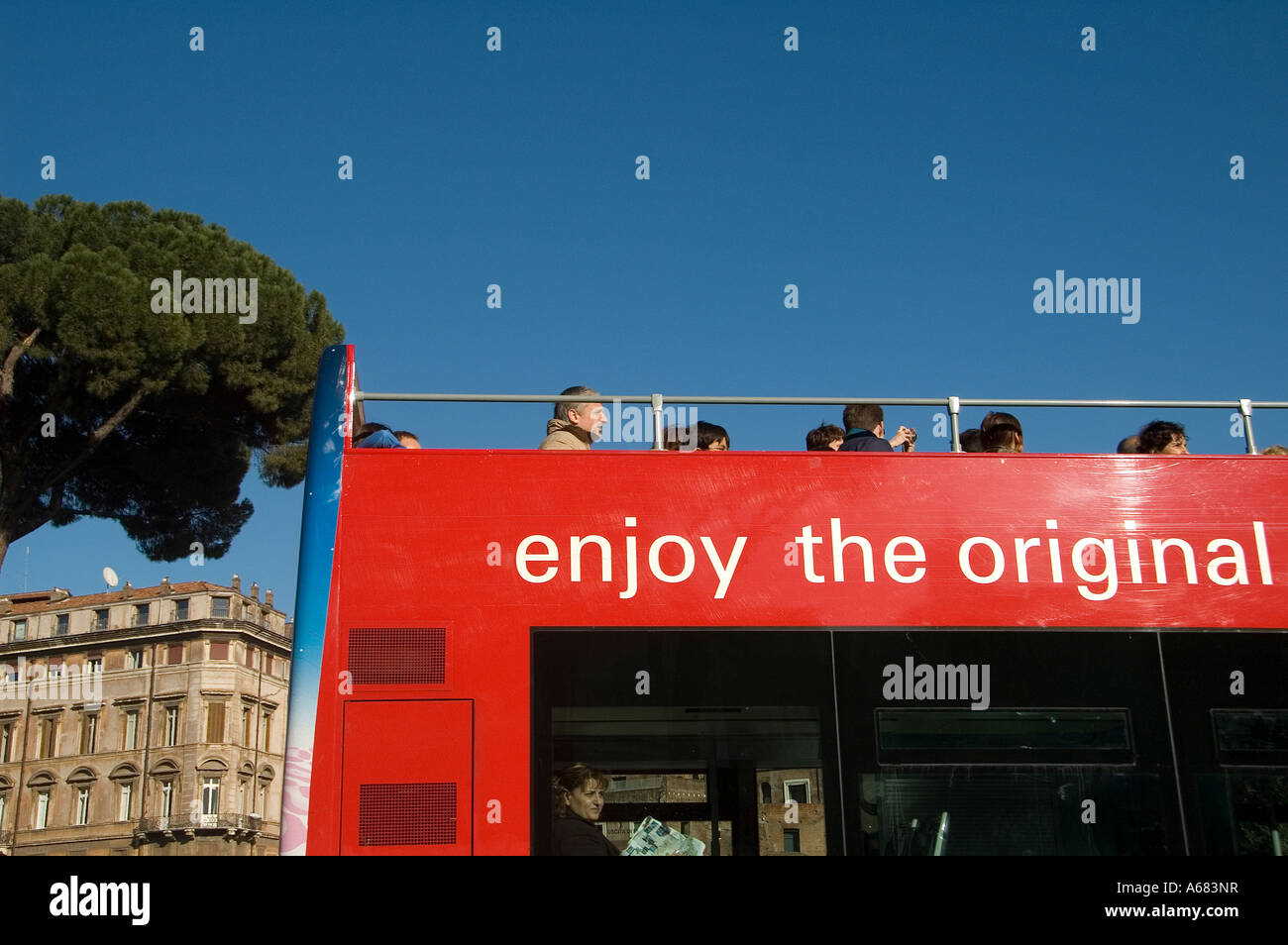 Tourists sightseeing city on a Hop-on Hop-off double-decker tour bus in Rome Italy Stock Photo