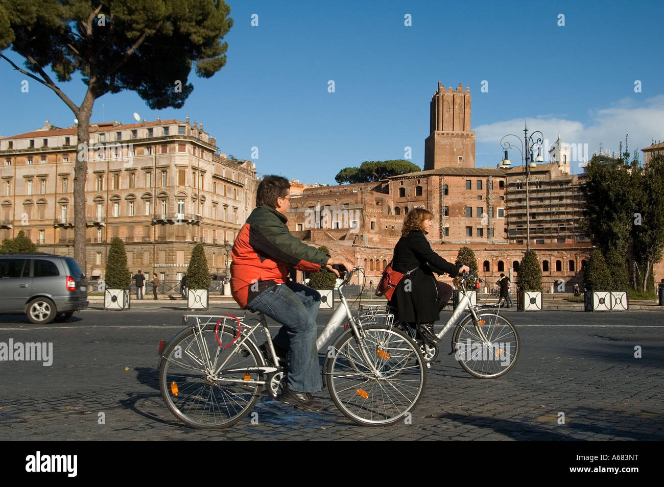 Cycling in Via dei fori Imperiali street, Rome Italy Stock Photo