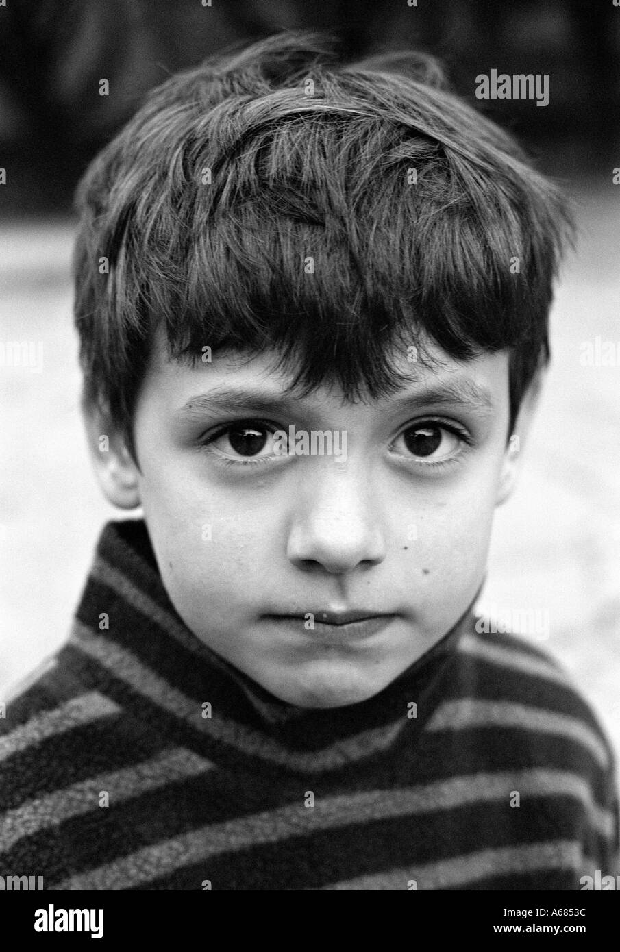 close crop portrait of boy looking at camera Stock Photo - Alamy