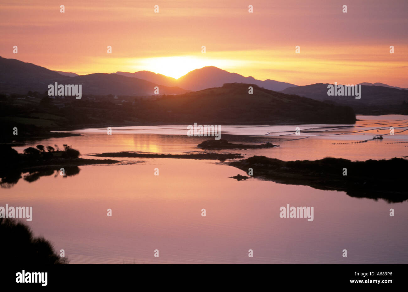 irish coastal calm sea inlet at dusk, beauty in nature Stock Photo - Alamy