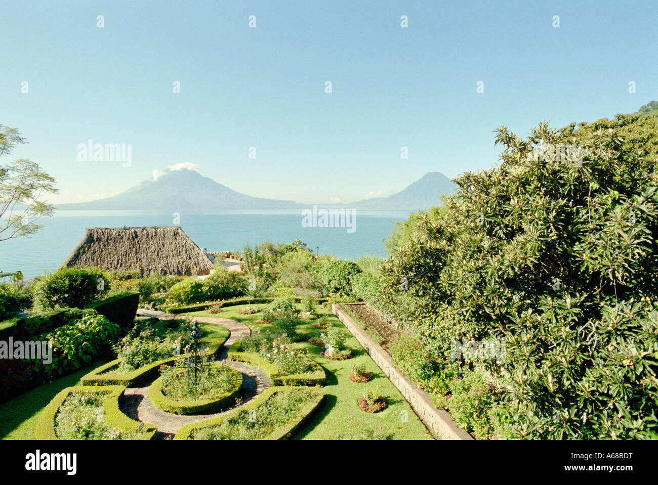 Gardens and lake at Hotel Atitlan, Santiago, Atitlan, Guatemala Stock ...