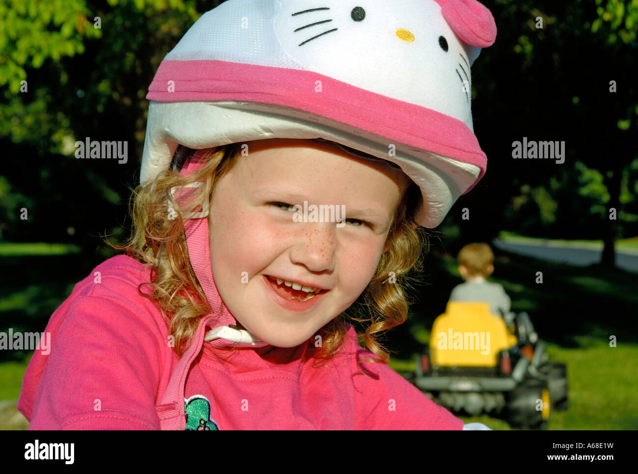 Smiling five year old girl with bike safety helmet Stock Photo Alamy