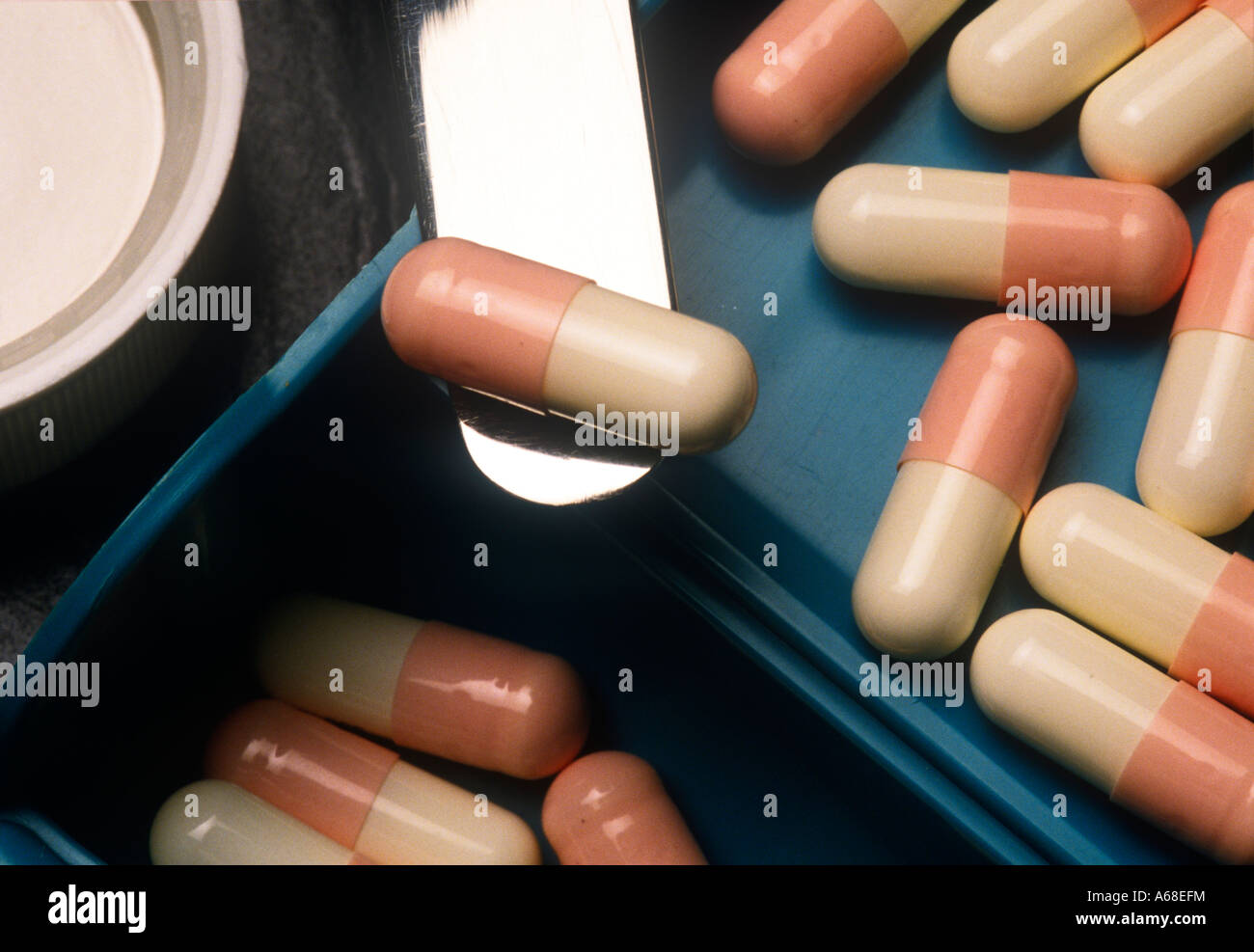 Prescription drugs being counted in a pharmacy Stock Photo