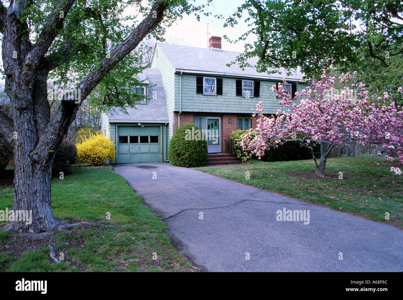 A driveway leads to a suburban Boston house Stock Photo