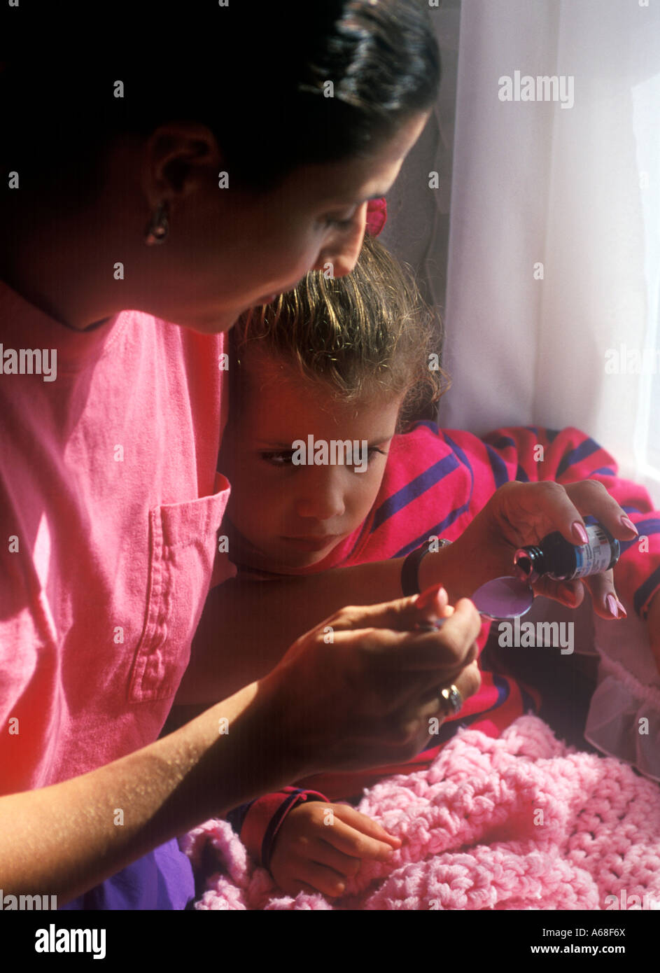 Medicine time Mother and daughter Stock Photo