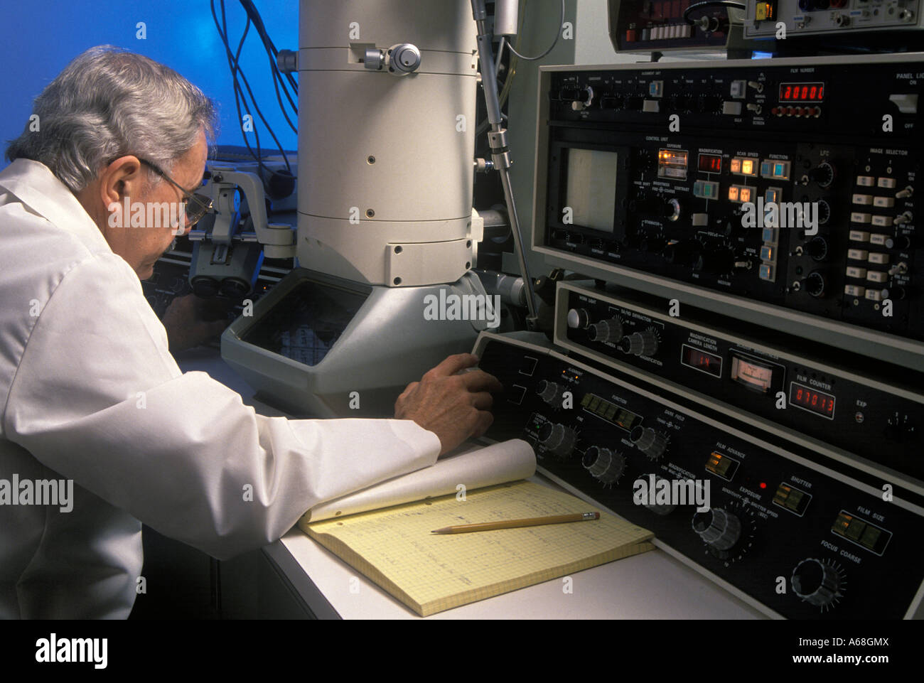Researcher at an electron microscope Stock Photo