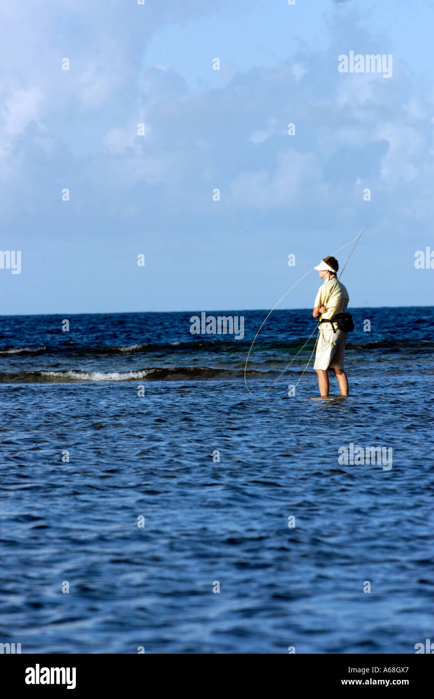 British Virgin Islands Caribbean Man salt water fly fishing for bone fish on the flats in the Virgin Gorda Sound Stock Photo