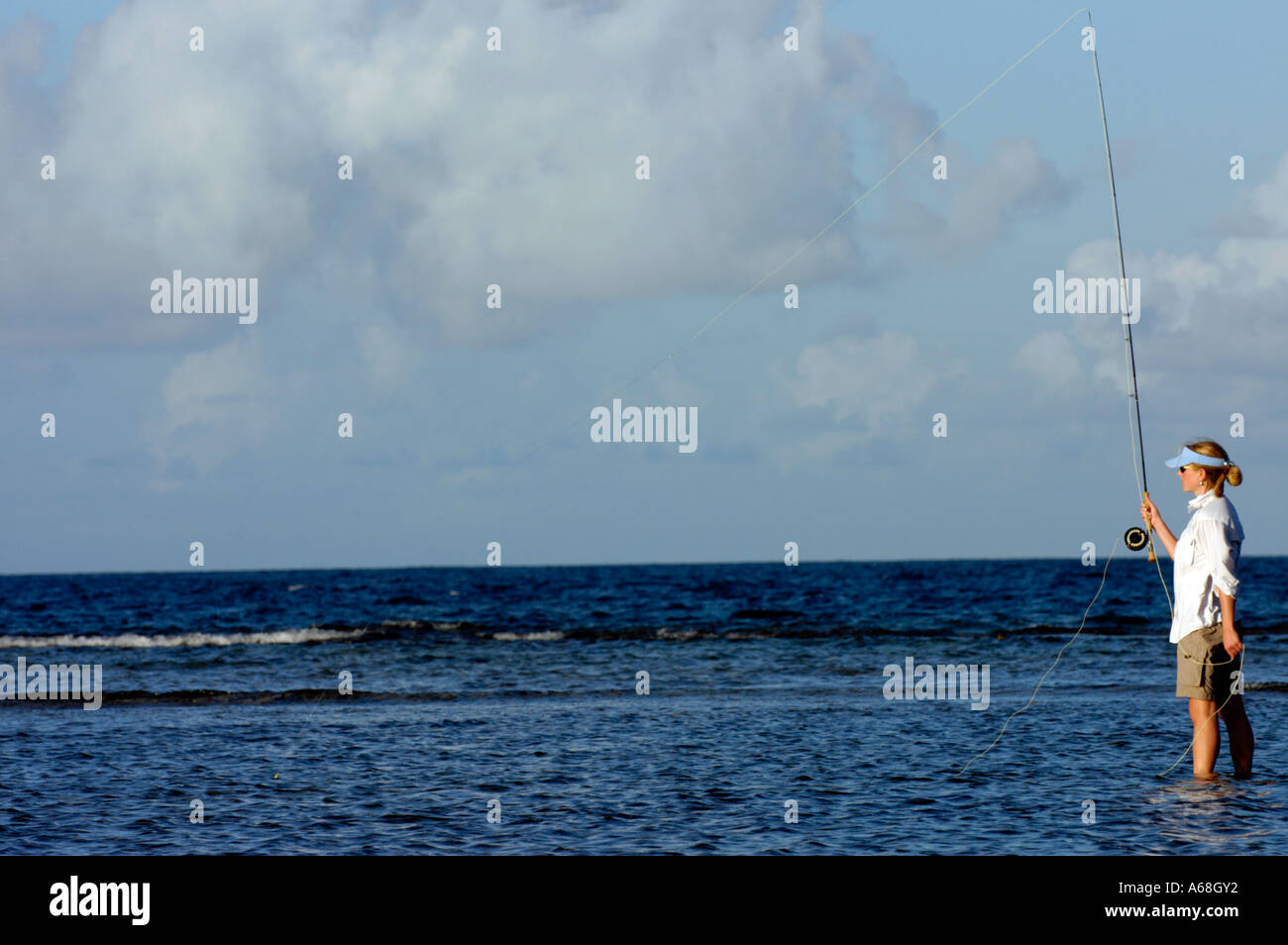 British Virgin Islands Caribbean Woman stripping line while salt water