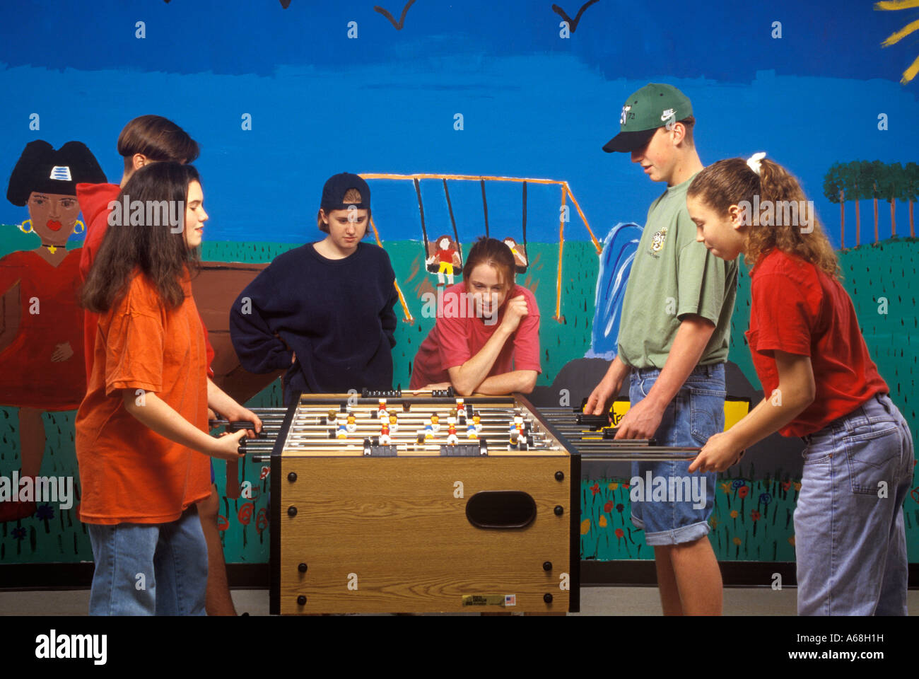 Teens playing foosball Stock Photo