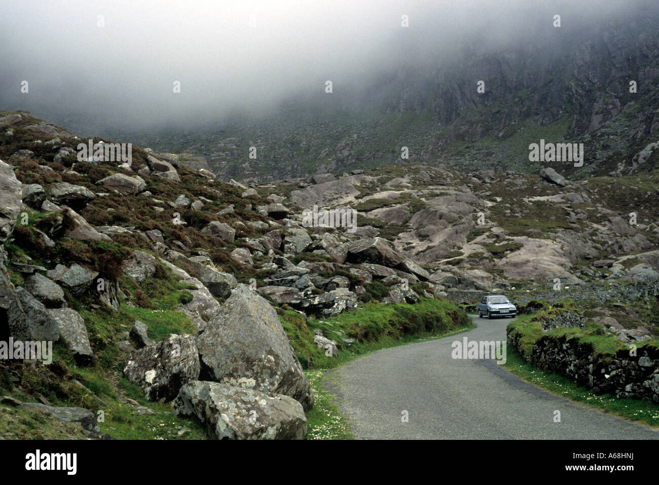 Connor Pass a narrow winding road through rocky glaciated mountains, gateway to Dingle, County Kerry, Ireland Stock Photo