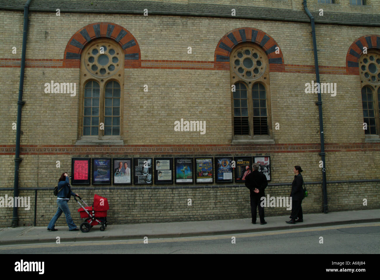 Cambridge Theatre brick wall and posters Stock Photo