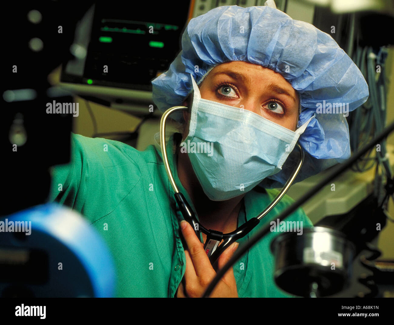 Anesthesiologist monitors a surgical patient Stock Photo