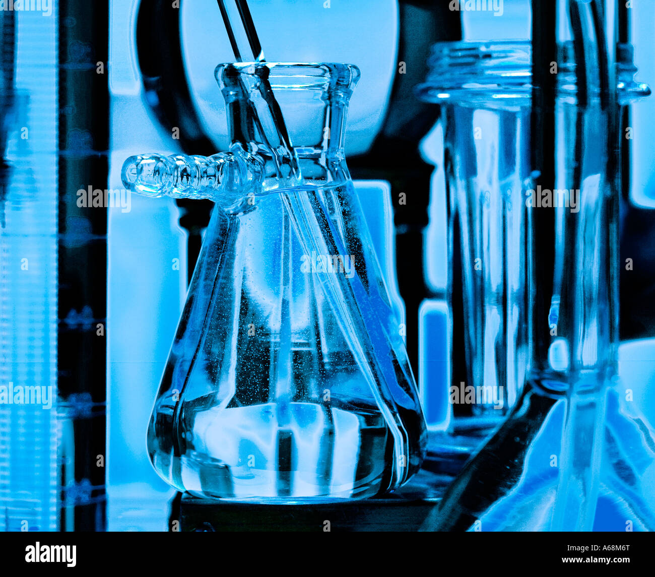 Glass vials and beakers used in medical scientific research lab
