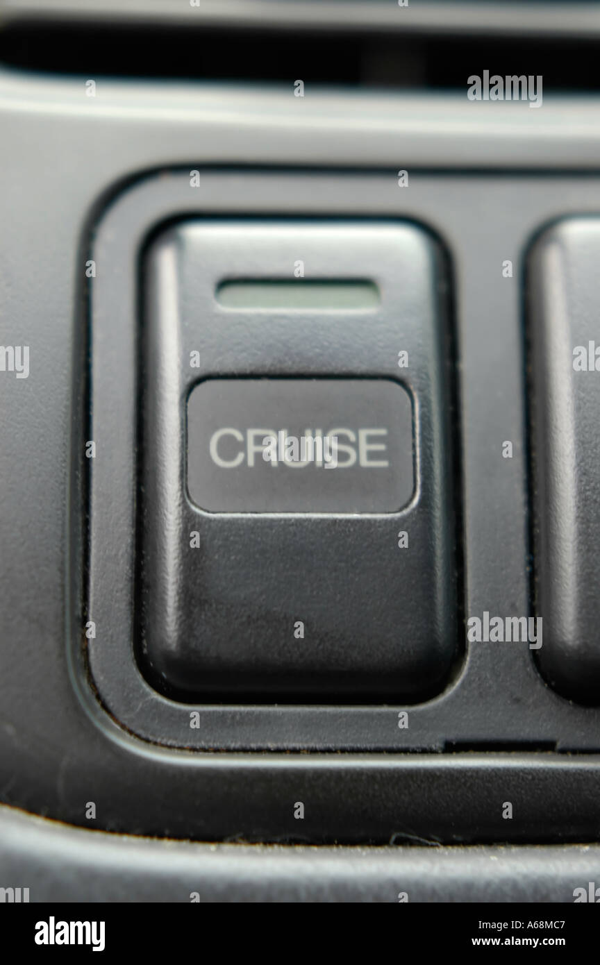 Cruise control button on the dashboard of an automobile Stock Photo Alamy