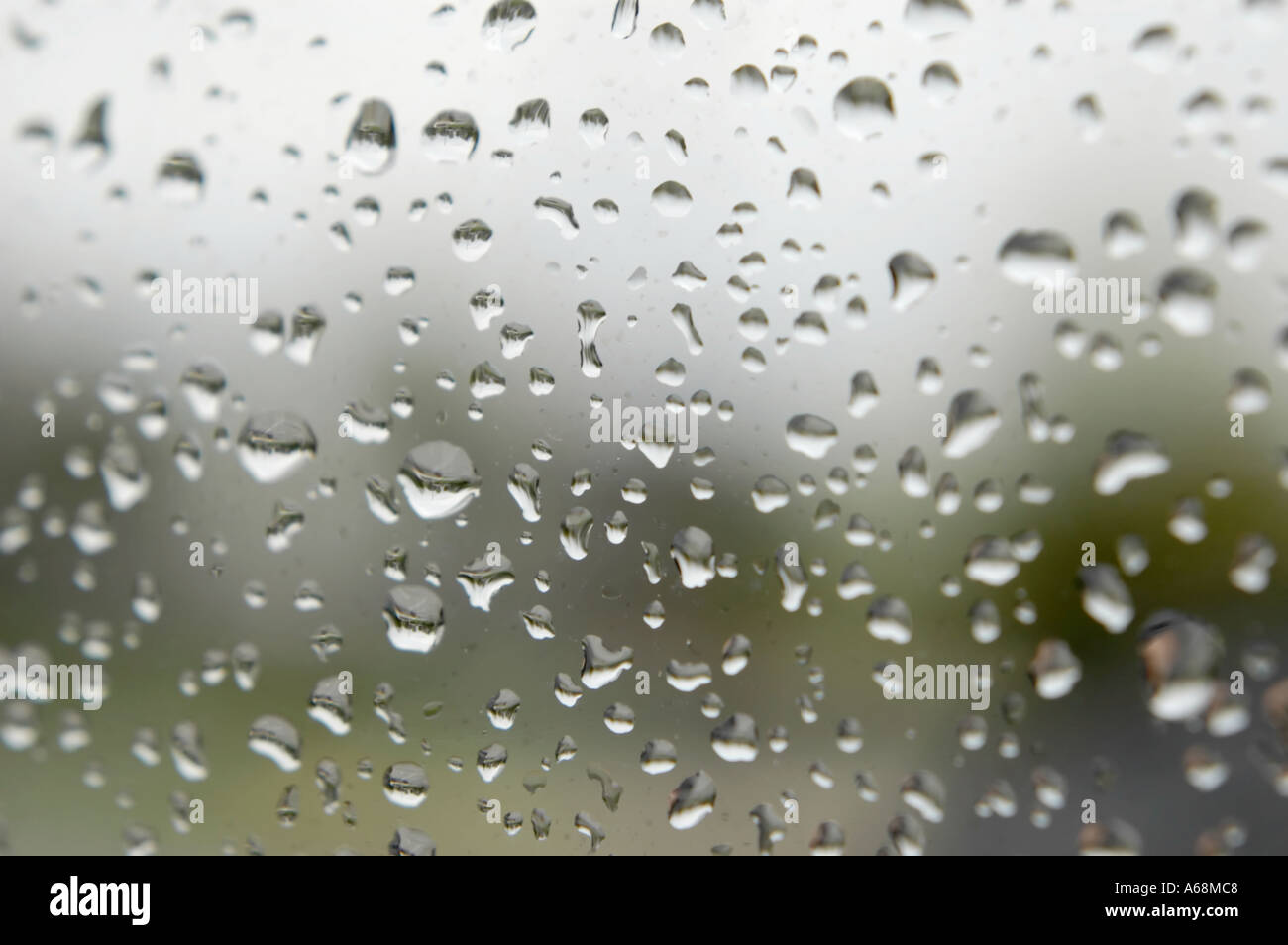 Drops of rain beaded on an automobile mirror Stock Photo