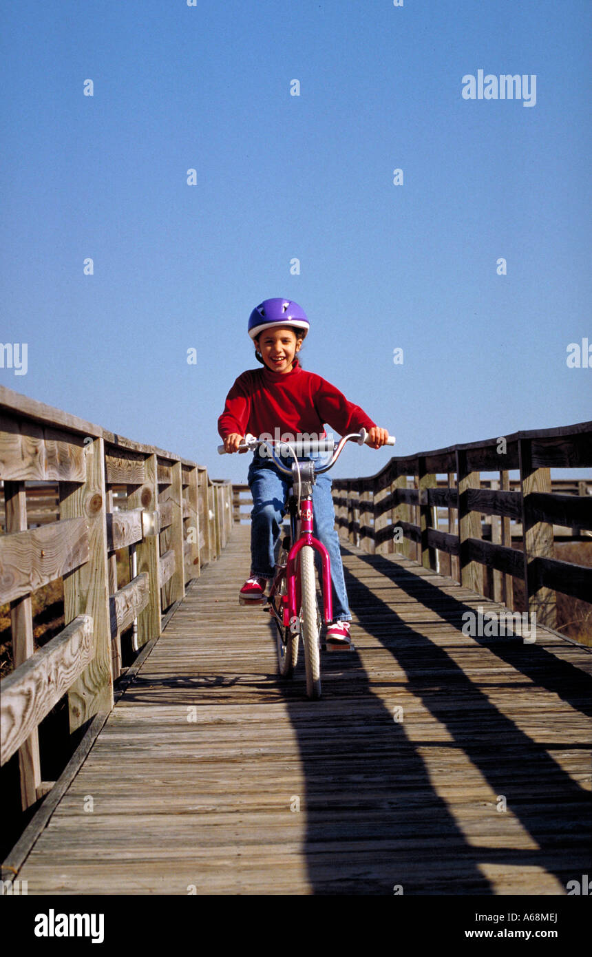 girl learning to ride a bike