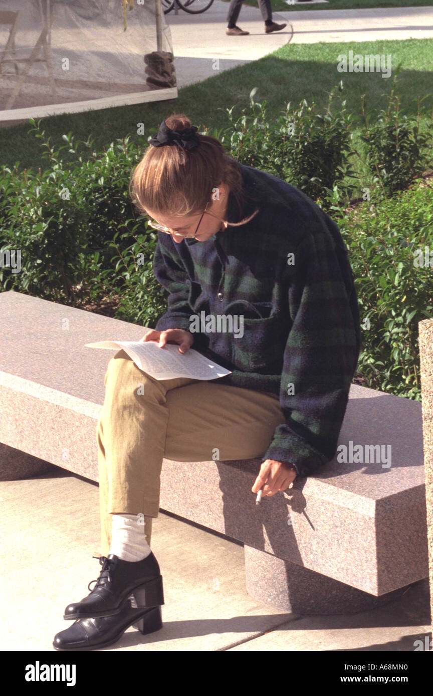 Student age 20 smoking at Biomedical Engineering Building open house. Minneapolis Minnesota USA Stock Photo