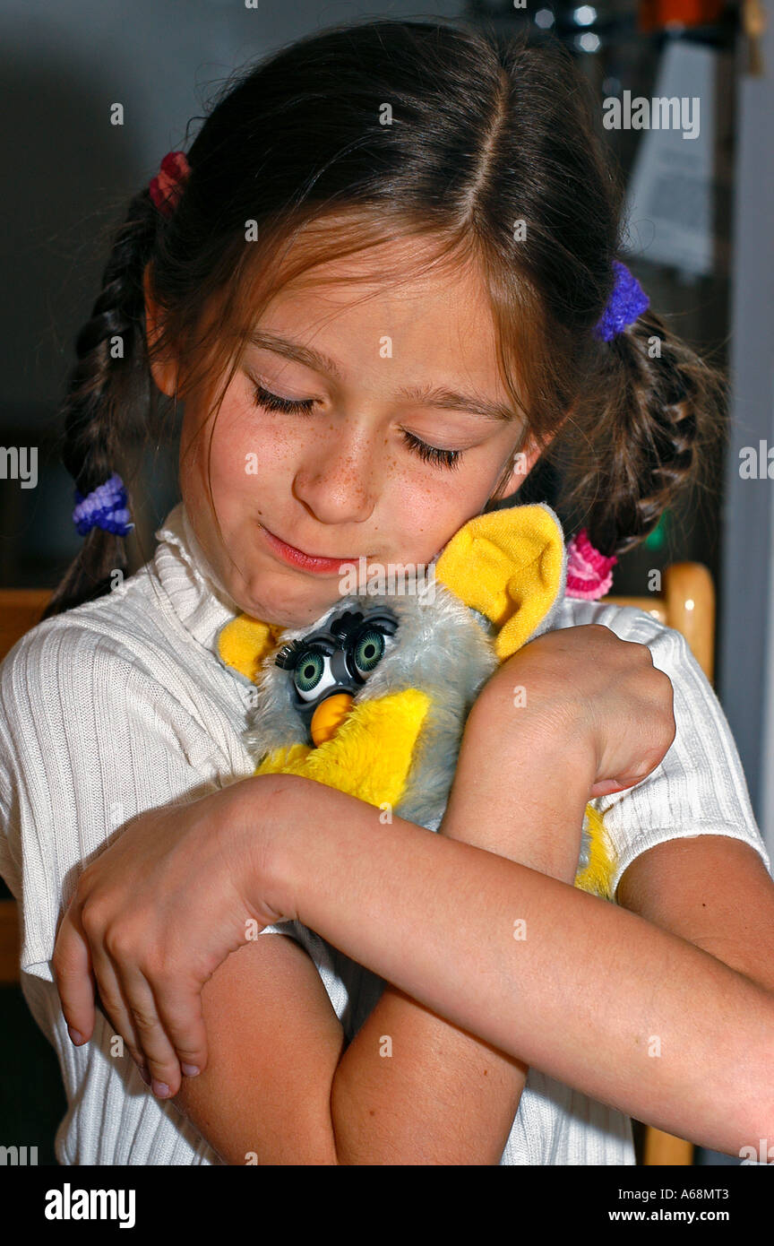 A portrait of a girl with a toy Stock Photo - Alamy